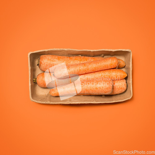 Image of Gotta keep those eyes strong. a box of carrots against a studio background.