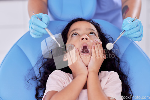 Image of If a patient cannot clean his teeth, no dentist can. a little girl looking shocked at the dentist.