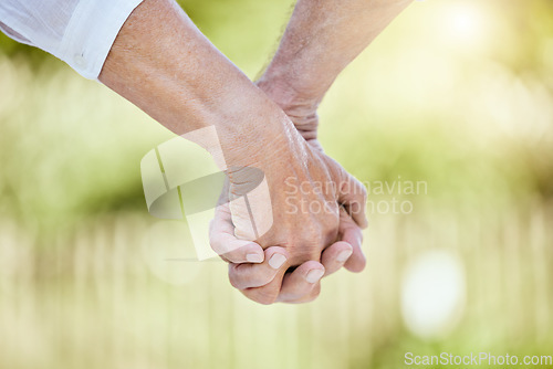 Image of The only thing worth holding on to is each other. a senior couple holding hands while spending time outdoors.