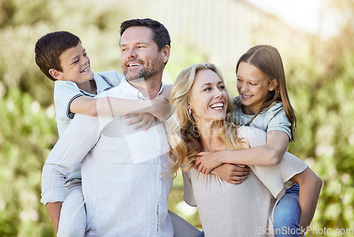 Image of There is no greater love compared to a parent’s love. a couple spending time outdoors with their two children.