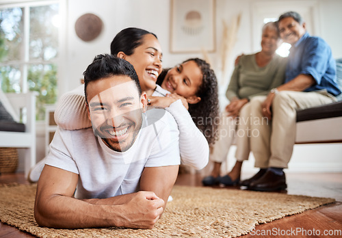 Image of Laughter keeps the bond strong. a young family spending time together at home.