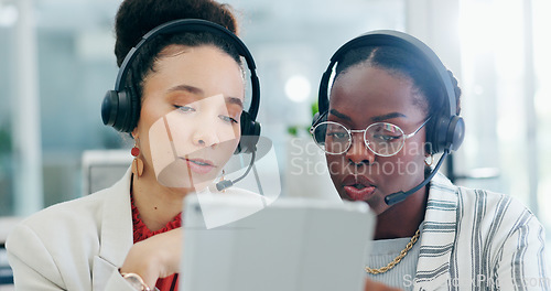 Image of Call center, women and tablet with teamwork, consulting or agent in customer service, thinking or coaching. African employees, tech support and training for FAQ, sales lead or telemarketing with voip