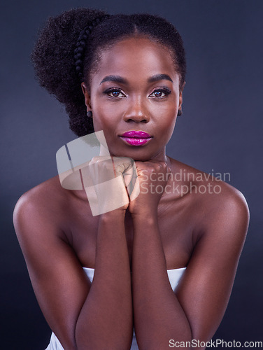 Image of Embracing your true self radiates a beauty that cannot be ignored. Studio portrait of a beautiful young woman posing against a black background.