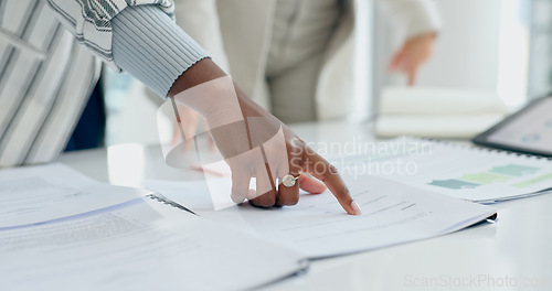 Image of Hand, documents or planning with a business person reading information in the office closeup for strategy. Finger, pointing and report with a corporate employee in a professional workplace for review