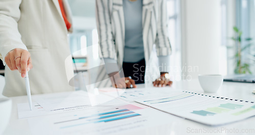 Image of Women, hands, coffee and discussion with documents, reading or analysis for report in workplace. Partnership, coaching and paperwork at desk for proposal, compliance or research in financial agency