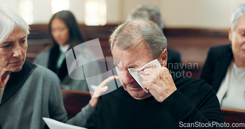 Image of Sad, funeral and senior man crying in church for God, holy spirit or religion in Christian community cathedral. Tissue, grief or support for upset elderly person in chapel for emotional pain and loss