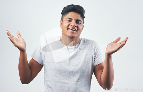 Image of Lets laugh about it and move on. Studio shot of a young man posing against a white background.