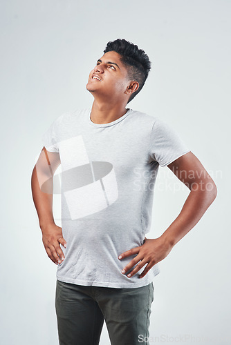 Image of Well have to do something with this copy-space. Studio shot of a young man posing against a white background.