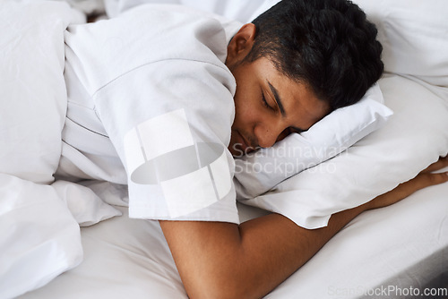 Image of Theres nothing a good nap cant fix. a young man sleeping in his bed.