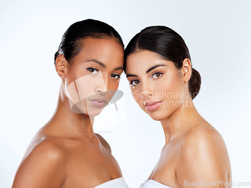 Image of Why be like everyone else when you can be you. Studio shot of beautiful young women posing against a grey background.