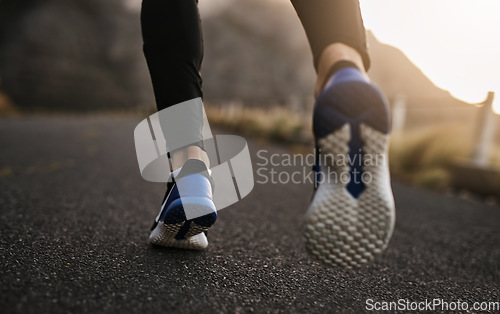 Image of Every step is progress. Closeup shot of an unrecognizable man exercising outdoors.