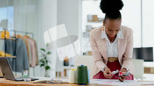 Image of Black woman, fashion designer and color swatches in planning, strategy or ideas for project at boutique. African female person in small business, plan and palette in clothing design at retail store