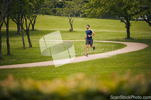 Image of Know what is good for you. a sporty middle-aged man out running in a park.