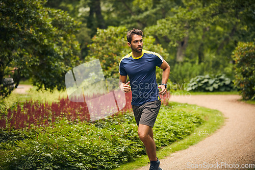 Image of Nothing can stop you if you dont want to be stopped. a sporty middle-aged man out running in a park.