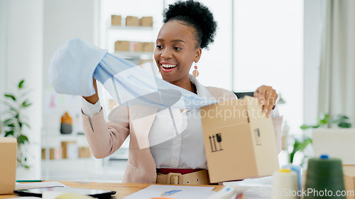 Image of Happy black woman, fashion designer and box with material in small business, logistics or supply chain at boutique store. African female person or entrepreneur smile with clothing parcel or package