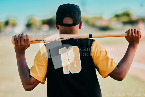 Image of Theres a story behind every number. Rearview shot of a baseball player carrying his bat on his shoulders.