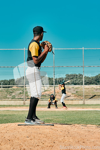 Image of A really good pitcher is tough to beat. a young baseball player getting ready to pitch the ball during a game outdoors.