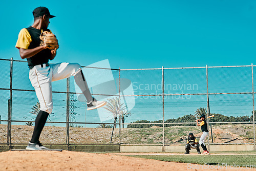 Image of Three strikes and youre out. a young baseball player getting ready to pitch the ball during a game outdoors.