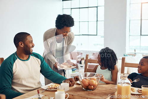 Image of Who said breakfast cant be fun. a family having breakfast together at home.