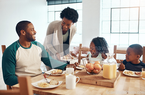 Image of When it comes to our family, we make breakfast fun. a family having breakfast together at home.