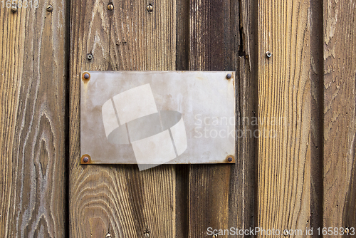 Image of sign on wooden board