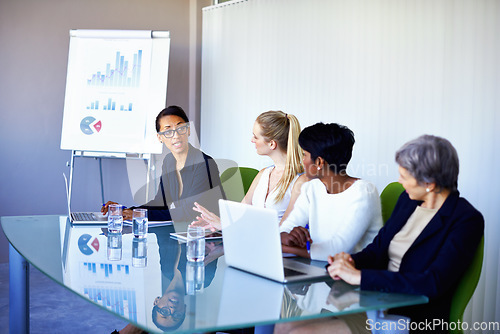 Image of The morning meeting. a group of coworkers having a meeting in the boardroom.