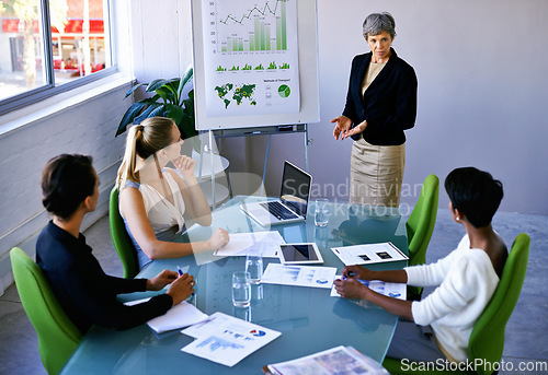 Image of Projecting future growth. a group of coworkers having a meeting in the boardroom.