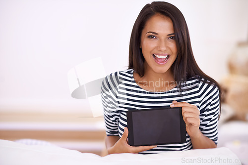 Image of Im so excited about my new app. Portrait of an attractive young woman holding up her digital tablet.
