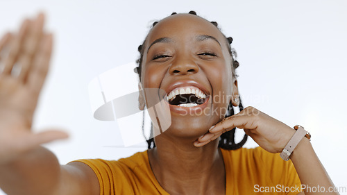 Image of Black woman, portrait and smile in studio for selfie, live streaming vlog and content creation isolated on white background. Happy african model, laugh and profile picture for social media broadcast