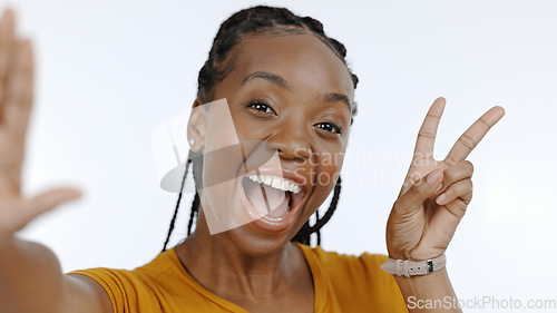 Image of Excited, face and selfie, black woman and peace hand sign with memory and social media on white background. Smile for profile picture, live streaming and influencer with content creation in studio