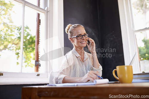 Image of Thats a Friday smile. Low angle portrait of a beautiful young woman working from home.