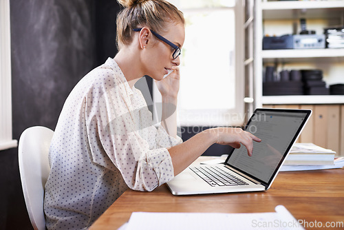 Image of Which website was that again. A cropped shot of a beautiful young woman working from home.