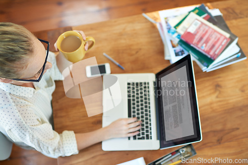 Image of Shes enjoying the freedom of freelancing. a young woman working from home.