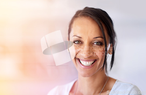 Image of Shes got the right attitude for a successful career. Portrait of a happy woman in a casual office environment.