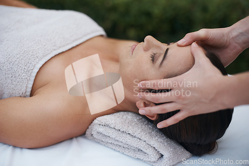 Image of Perfect zen in the garden. an attractive woman enjoying a massage at a spa.