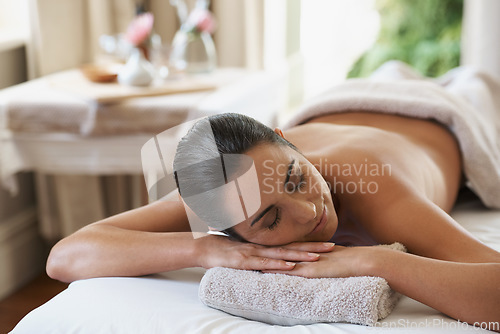 Image of Shes in the mood for a massage. an attractive woman resting on a massage table.