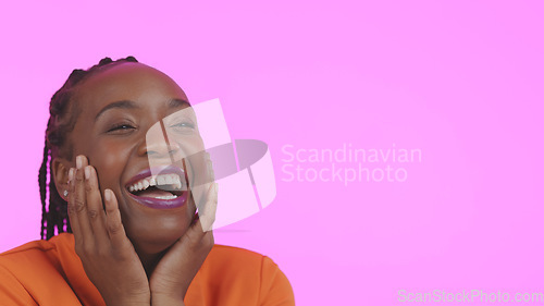 Image of Woman, hands and excited or face and laughing, funny and cheerful expression by pink background in studio. Black person, positive and success with make up or beauty aesthetic, joy and mockup space