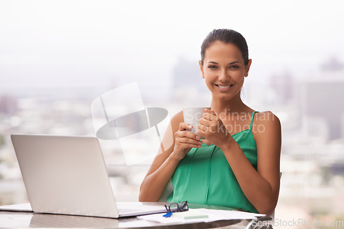 Image of Give her enough coffee and she could rule the world. A vibrant young woman smiling happily at the camera.