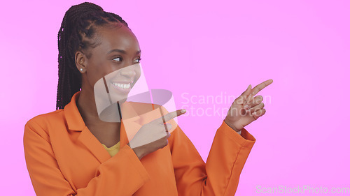 Image of Black woman, pointing and advertising presentation with information or news, smile with presenter on pink background. Mockup, launch announcement with marketing ads and coming soon in a studio