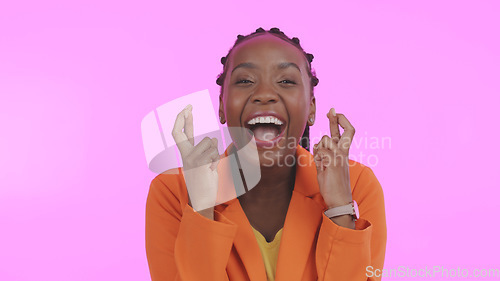Image of Woman, winner and fingers crossed for happy, excited and face for good luck, purple studio background or wow. Energy, winning or hope for achievement, competition and wish to win, surprise or offer