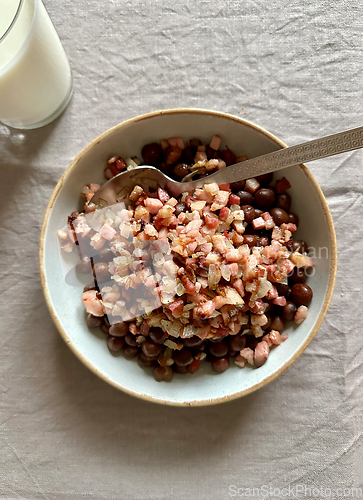 Image of bowl of grey peas with smoked bacon and onions