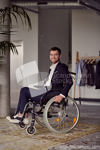 Image of Businessman in a wheelchair commands attention, symbolizing resilience and success amidst a dynamic modern office environment.