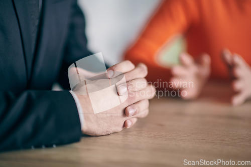 Image of Closeup photo, the hands of businessmen sitting at a business meeting can be seen as they discuss various business ideas and engage in productive collaboration.