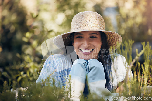 Image of If a tree dies, plant another in its place. a young female florist working at a nursery.