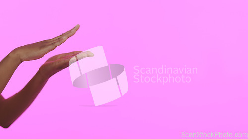 Image of Hands, beauty and mockup with a person on a pink background in studio for advertising or marketing. Skincare, banner and space with a model closeup on a color wall for a salon or spa treatment