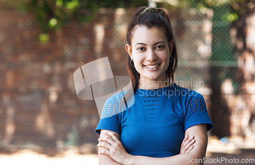 Image of Ive got confidence in my game. Cropped portrait of an attractive young female athlete standing with her arms folded on the basketball court.