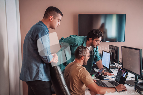 Image of Programmers engrossed in deep collaboration, diligently working together to solve complex problems and develop innovative mobile applications with seamless functionality.