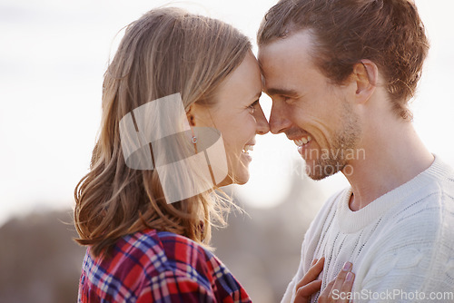 Image of Face to face with the one she loves. an attractive young couple standing face to face.