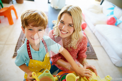 Image of Play helps kids use their creativity while developing their imagination. Portrait of a mother and son having fun together at home.