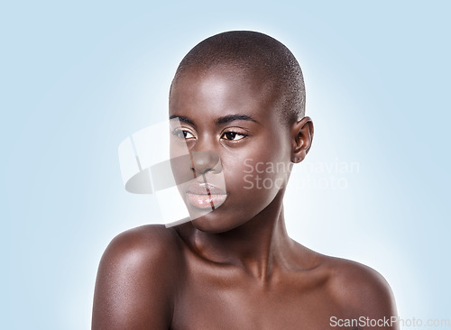 Image of Im thinking of you, can you hear me. Cropped studio shot of a beautiful african woman on a blue background.